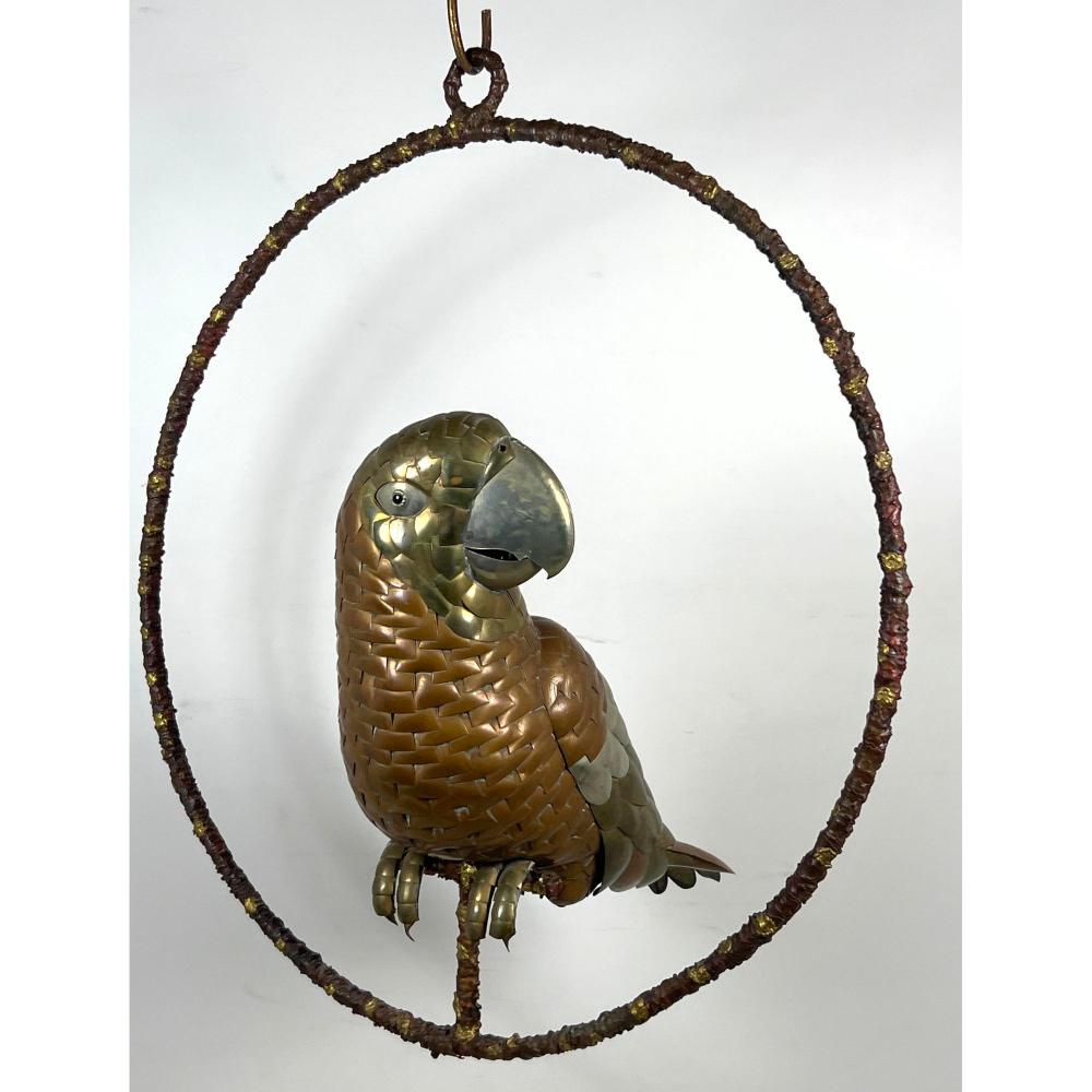 LARGE MIXED METAL BRASS AND COPPER PARROT SCULPTURE ON HANGING HOOP PERCH. UNSIGNED. ATTRIBUTED TO B