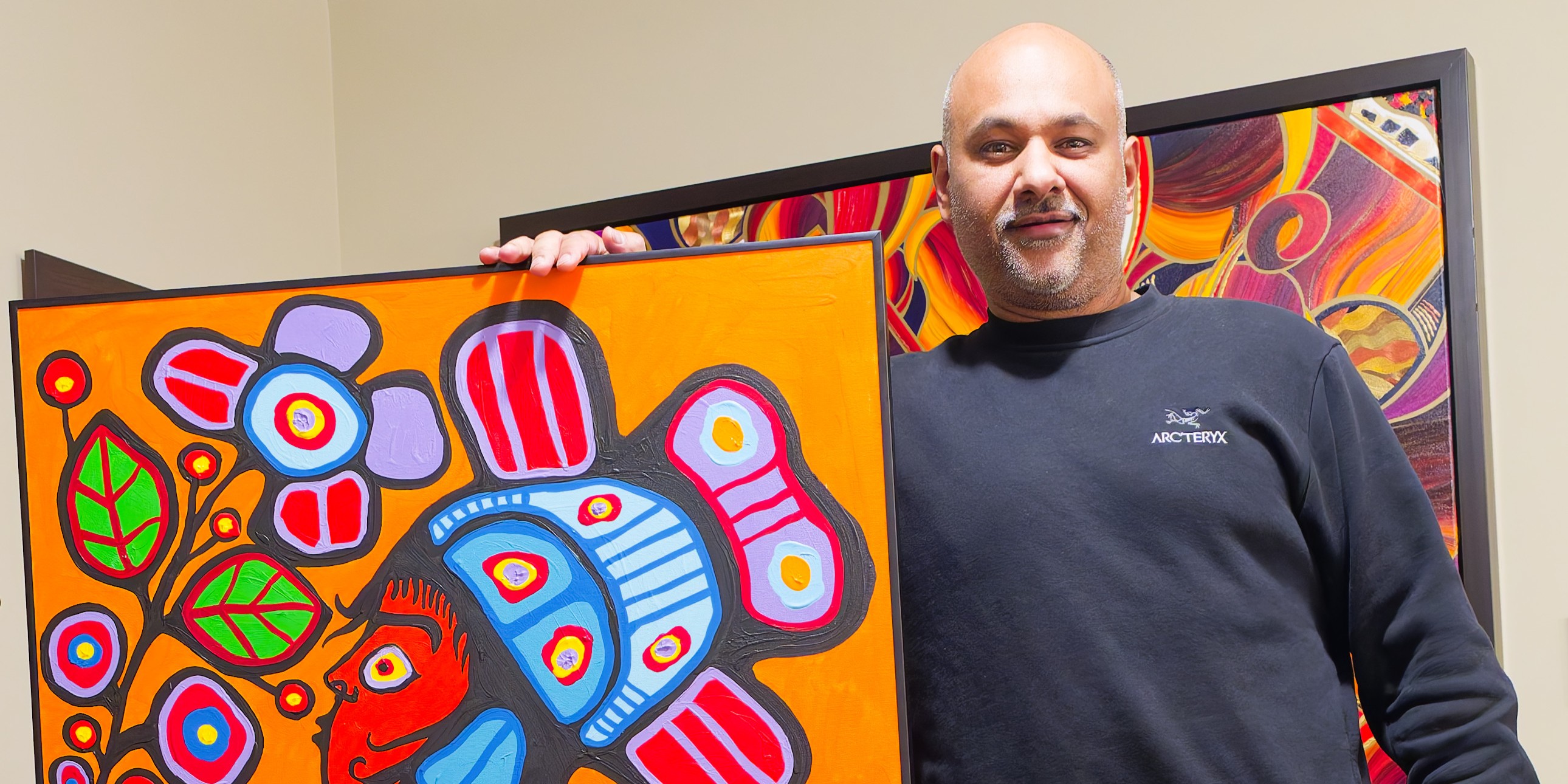 With a Norval Morrisseau painting